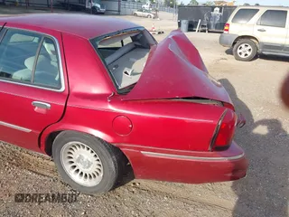 2000 Mercury Grand Marquis LS z VIN 2MEFM75W1YX736283, wystawiony jako IAAI lot #41879063 z przebiegiem 114 535 mil mil oraz . Historia ofert i sprzedaży dostępna na DreamBid. Obrazek 15.