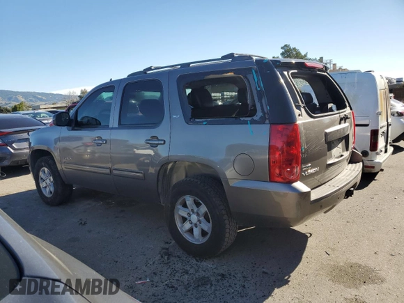 2012 GMC Yukon SLT with VIN 1GKS1CE03CR137258, listed as a Copart auction lot 87684815 with 253,348 mi miles and Salvage Title. Bid and sale history available at carsss.com. Image 2.