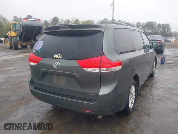 2013 Toyota Sienna XLE AAS with VIN 5TDYK3DC8DS401561, listed as a IAAI auction lot 41990044 with 214,111 mi miles and . Bid and sale history available at DreamBid. Image 4.