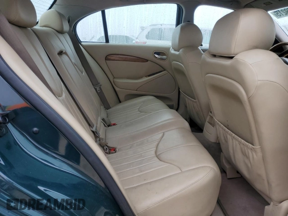 2002 Jaguar S-Type with VIN SAJDA01P12GM27242, listed as a Copart auction lot 88579215 with 218,546 mi miles and Salvage Title. Bid and sale history available at DreamBid. Image 10.