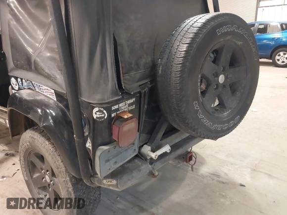 1999 Jeep Wrangler Sahara z VIN 1J4FY49S4XP432567, wystawiony jako IAAI lot #41562455 z przebiegiem Nie podano mil oraz . Historia ofert i sprzedaży dostępna na DreamBid. Obrazek 6.