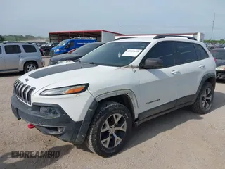 2015 Jeep Cherokee Trailhawk with VIN 1C4PJMBS6FW687718, listed as a IAAI auction lot 42505169 with 122,526 mi miles and . Bid and sale history available at DreamBid. Image 2.