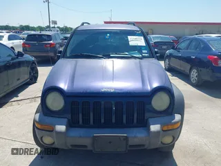 2004 Jeep Liberty Sport with VIN 1J4GK48KX4W241129, listed as a IAAI auction lot 41980258 with 259,048 mi miles and . Bid and sale history available at DreamBid. Image 6.