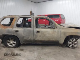 2005 GMC Envoy SLT z VIN 1GKDT13S752254350, wystawiony jako IAAI lot #41301432 z przebiegiem Nie podano mil oraz . Historia ofert i sprzedaży dostępna na DreamBid. Obrazek 13.