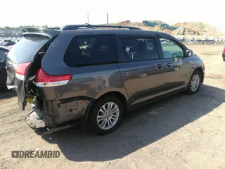 2014 Toyota Sienna XLE with VIN 5TDYK3DC2ES418860, listed as a IAAI auction lot 40139260 with 67,599 mi miles and . Bid and sale history available at DreamBid. Image 4.