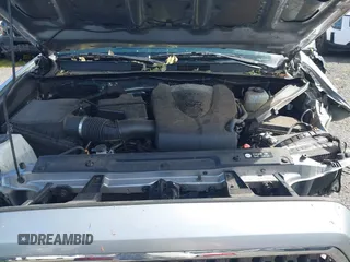 2018 Toyota Tacoma SR z VIN 3TMCZ5AN7JM156092, wystawiony jako IAAI lot #41642391 z przebiegiem 65 805 mil mil oraz . Historia ofert i sprzedaży dostępna na DreamBid. Obrazek 10.