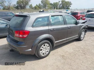 2015 Dodge Journey American Value Pkg with VIN 3C4PDCAB2FT641361, listed as a IAAI auction lot 40299991 with 202,003 mi miles. Bid and sale history available at carsss.com. Image 4.