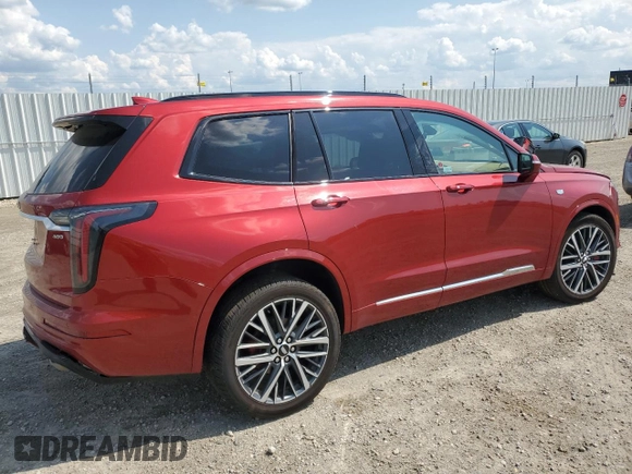 2024 Cadillac XT6 AWD Sport z VIN 1GYKPHRS0RZ724524, wystawiony jako Copart lot #61333185 z przebiegiem 12 799 mil mil oraz Nie do naprawy • Non repairable. Historia ofert i sprzedaży dostępna na DreamBid. Obrazek 3.