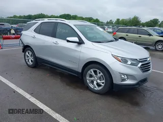 2021 Chevrolet Equinox Premier with VIN 3GNAXNEV4MS153066, listed as a IAAI auction lot 42413071 with 43,052 mi miles and . Bid and sale history available at DreamBid. Image 1.