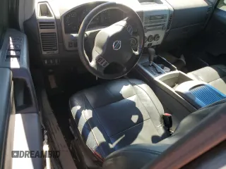 2005 Nissan Titan LE with VIN 1N6BA07B95N571880, listed as a Copart auction lot 57527435 with 199,577 mi miles and Salvage title. Bid and sale history available at DreamBid. Image 8.