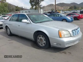 2001 Cadillac DeVille DHS z VIN 1G6KE57Y21U111097, wystawiony jako IAAI lot #42137693 z przebiegiem 90 680 mil mil oraz . Historia ofert i sprzedaży dostępna na DreamBid. Obrazek 1.