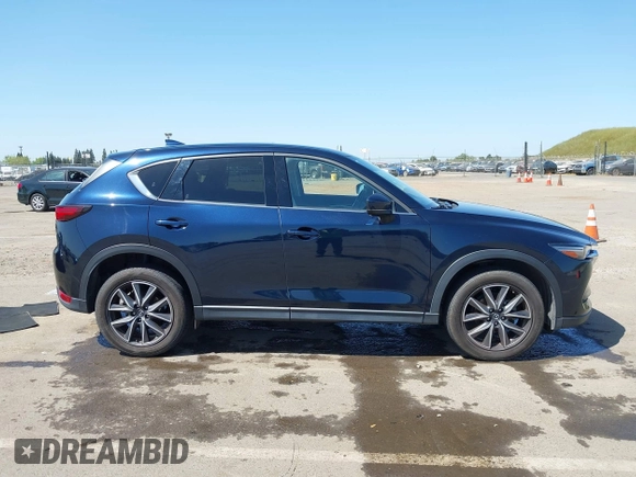 2018 Mazda CX-5 Grand Touring с VIN JM3KFBDM6J0326684, выставлен на аукционе IAAI как лот 42087646 с пробегом 111 192 миль миль и . История ставок и продаж доступна на DreamBid. Изображение 13.