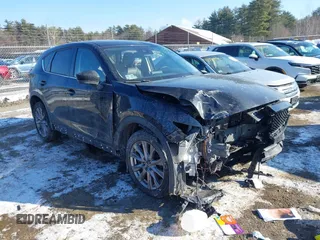 2020 Mazda CX-5 Grand Touring with VIN JM3KFBDM7L1807685, listed as a IAAI auction lot 41392313 with 91,729 mi miles and . Bid and sale history available at carsss.com. Image 1.