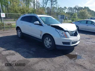 2013 Cadillac SRX Luxury Collection with VIN 3GYFNCE33DS608040, listed as a IAAI auction lot 41912860 with 128,295 mi miles. Bid and sale history available at carsss.com. Image 1.