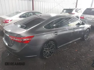 2015 Toyota Avalon Limited with VIN 4T1BK1EB6FU164773, listed as a IAAI auction lot 41877742 with 128,858 mi miles and . Bid and sale history available at DreamBid. Image 4.