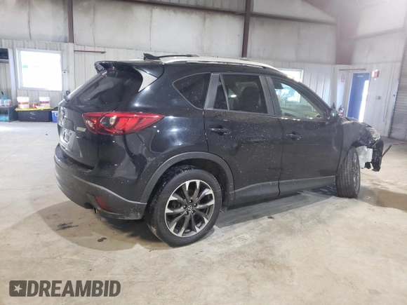 2016 Mazda CX-5 Grand Touring with VIN JM3KE4DY6G0655802, listed as a Copart auction lot 43820475 with 76,639 mi miles and Salvage Title. Bid and sale history available at carsss.com. Image 3.