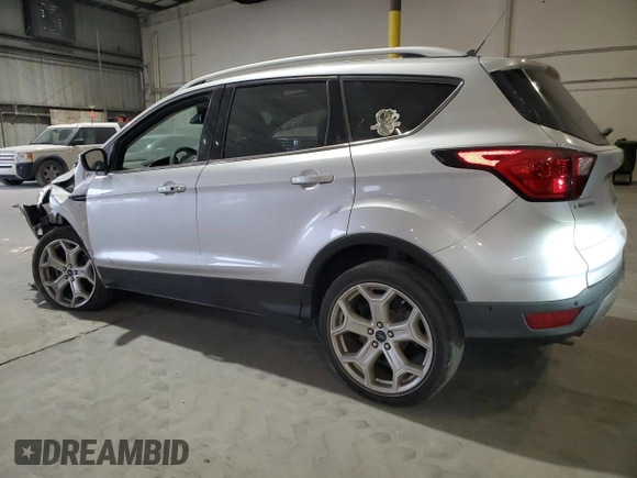 2019 Ford Escape Titanium with VIN 1FMCU0J96KUB77741, listed as a Copart auction lot 57517325 with 90,002 mi miles and Non repairable. Bid and sale history available at DreamBid. Image 2.