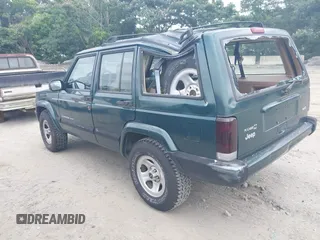 2000 Jeep Cherokee z VIN 1J4FT48S4YL265734, wystawiony jako IAAI lot #42556994 z przebiegiem 228 162 mil mil oraz . Historia ofert i sprzedaży dostępna na DreamBid. Obrazek 3.