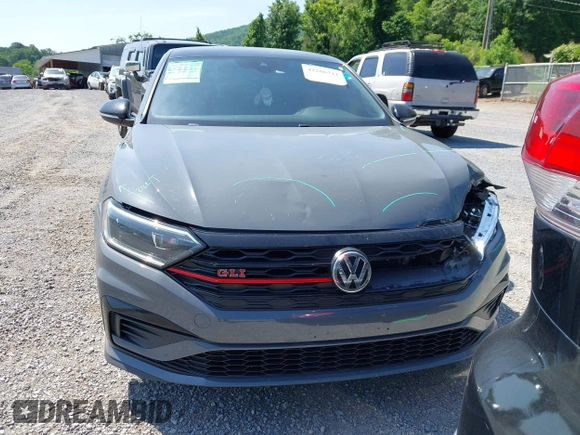2021 Volkswagen Jetta GLI S z VIN 3VW6T7BU9MM052902, wystawiony jako IAAI lot #42286711 z przebiegiem 91 519 mil mil oraz . Historia ofert i sprzedaży dostępna na DreamBid. Obrazek 13.