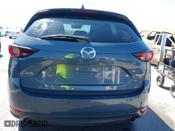 2021 Mazda CX-5 Touring with VIN JM3KFACM1M0317763, listed as a IAAI auction lot 41775712 with 75,068 mi miles. Bid and sale history available at carsss.com. Image 16.