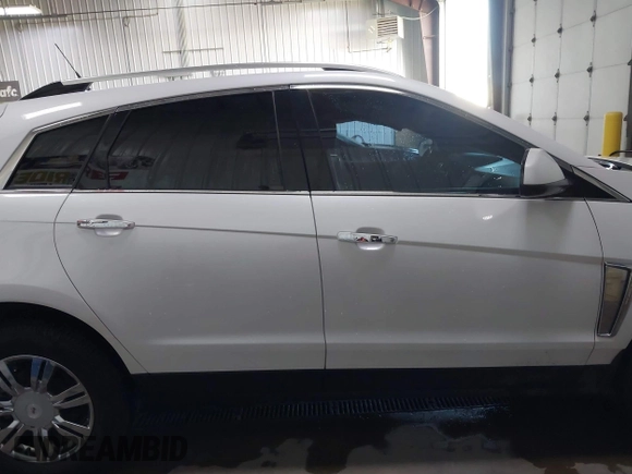 2014 Cadillac SRX Performance Collection with VIN 3GYFNFE36ES615440, listed as a IAAI auction lot 41830849 with 125,128 mi miles and . Bid and sale history available at DreamBid. Image 14.