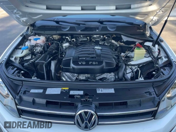2014 Volkswagen Touareg Sport with VIN WVGEF9BP7ED003332, listed as a Copart auction lot 63043535 with 179,727 mi miles and Salvage title. Bid and sale history available at DreamBid. Image 7.