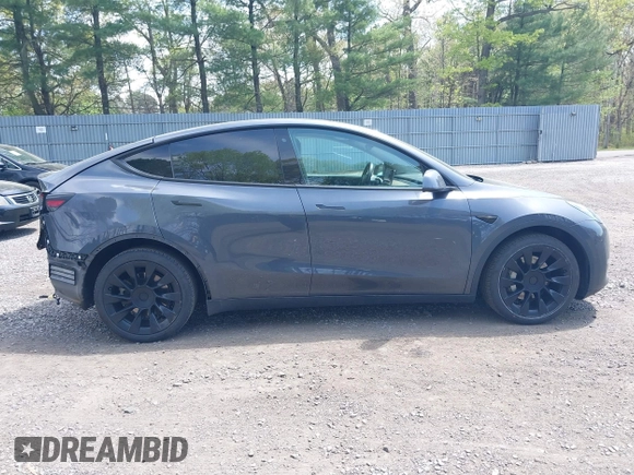 2020 Tesla Model Y Long Range with VIN 5YJYGDEE2LF029385, listed as a IAAI auction lot 42164786 with 58,685 mi miles and . Bid and sale history available at DreamBid. Image 13.