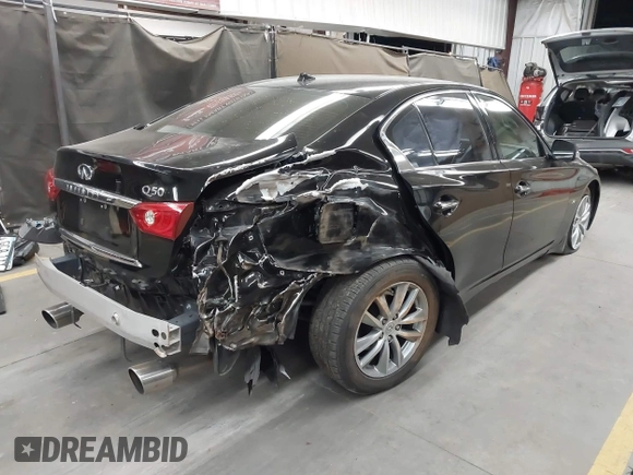 2014 Infiniti Q50 Premium with VIN JN1BV7AP6EM676289, listed as a IAAI auction lot 42304661 with 117,905 mi miles and . Bid and sale history available at DreamBid. Image 4.