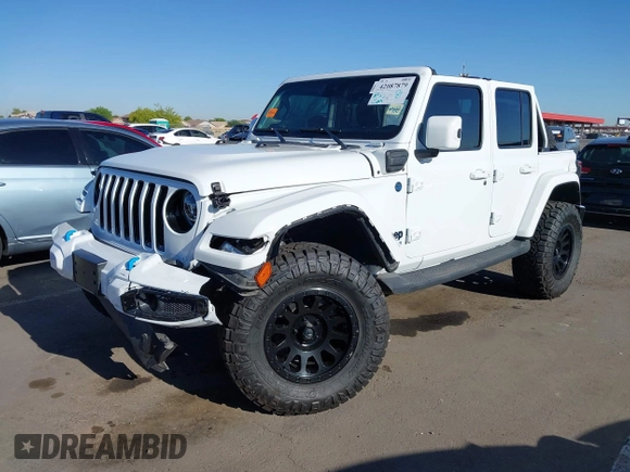 2021 Jeep Wrangler Unlimited Sahara with VIN 1C4JJXP63MW716690, listed as a IAAI auction lot 42087879 with 40,889 mi miles and . Bid and sale history available at DreamBid. Image 2.