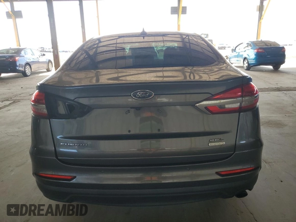 2020 Ford Fusion SEL z VIN 3FA6P0CD3LR131180, wystawiony jako Copart lot #63843355 z przebiegiem 146 705 mil mil oraz Czysty tytuł • Clean title. Historia ofert i sprzedaży dostępna na DreamBid. Obrazek 6.