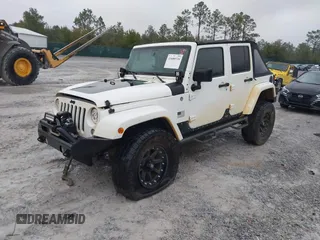 2014 Jeep Wrangler Unlimited Sahara with VIN 1C4BJWEG0EL151473, listed as a IAAI auction lot 41600726 with 119,057 mi miles. Bid and sale history available at carsss.com. Image 17.