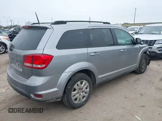 2019 Dodge Journey SE with VIN 3C4PDCBB0KT816103, listed as a IAAI auction lot 41640272 with 118,310 mi miles and . Bid and sale history available at DreamBid. Image 4.