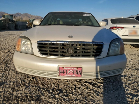 2001 Cadillac DeVille DHS z VIN 1G6KE57Y31U229255, wystawiony jako Copart lot #75101214 z przebiegiem 141 187 mil mil oraz Czysty tytuł • Clean title. Historia ofert i sprzedaży dostępna na DreamBid. Obrazek 5.