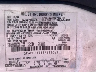 2003 Ford Taurus SE Standard z VIN 1FAFP58283A155067, wystawiony jako Copart lot #54555045 z przebiegiem 159 296 mil mil oraz Tytuł czysty. Historia ofert i sprzedaży dostępna na DreamBid. Obrazek 10.