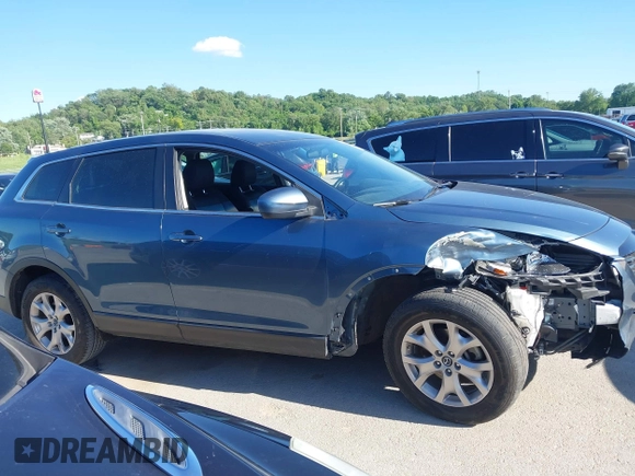 2015 Mazda CX-9 Sport z VIN JM3TB2BAXF0465720, wystawiony jako IAAI lot #42305436 z przebiegiem 130 543 mil mil oraz . Historia ofert i sprzedaży dostępna na DreamBid. Obrazek 13.