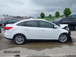 2018 Ford Focus SE z VIN 1FADP3F21JL257262, wystawiony jako IAAI lot #42174952 z przebiegiem 138 872 mil mil oraz . Historia ofert i sprzedaży dostępna na DreamBid. Obrazek 14.