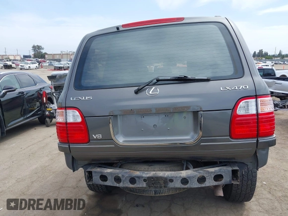 2001 Lexus LX 470 z VIN JTJHT00WX13509489, wystawiony jako IAAI lot #42227083 z przebiegiem 360 283 mil mil oraz . Historia ofert i sprzedaży dostępna na DreamBid. Obrazek 16.