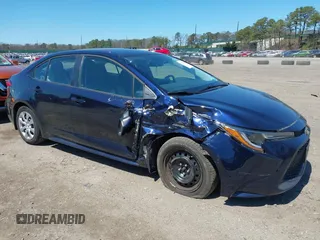 2022 Toyota Corolla LE with VIN 5YFEPMAE8NP320053, listed as a IAAI auction lot 42020183 with 6,673 mi miles and . Bid and sale history available at carsss.com. Image 6.