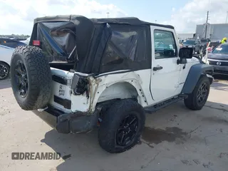 2015 Jeep Wrangler Willys Wheeler with VIN 1C4AJWAG0FL562536, listed as a IAAI auction lot 42384747 with 103,507 mi miles and . Bid and sale history available at DreamBid. Image 4.
