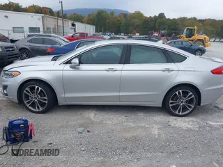 2019 Ford Fusion Titanium with VIN 3FA6P0K96KR120749, listed as a IAAI auction lot 40737085 with 118,376 mi miles and . Bid and sale history available at DreamBid. Image 14.