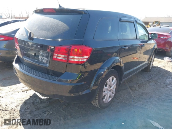 2013 Dodge Journey SE with VIN 3C4PDCAB7DT731506, listed as a IAAI auction lot 41762394 with 215,424 mi miles. Bid and sale history available at carsss.com. Image 4.