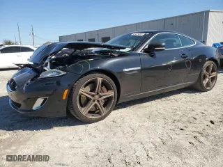 2015 Jaguar XK with VIN SAJWA4DCXFMB55227, listed as a Copart auction lot 48455465 with 64,050 mi miles and Salvage Title. Bid and sale history available at carsss.com. Image 1.