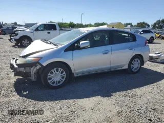 2010 Honda Insight LX z VIN JHMZE2H54AS003234, wystawiony jako Copart lot #56915385 z przebiegiem 320 644 mil mil oraz Czysty tytuł • Clean title. Historia ofert i sprzedaży dostępna na DreamBid. Obrazek 1.