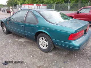 1996 Ford Thunderbird LX z VIN 1FALP62W9TH118637, wystawiony jako IAAI lot #42311641 z przebiegiem 96 361 mil mil oraz . Historia ofert i sprzedaży dostępna na DreamBid. Obrazek 3.
