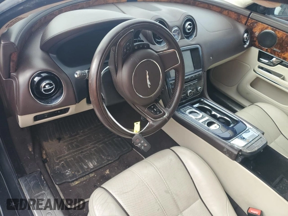 2013 Jaguar XJ with VIN SAJWA1C70D8V41578, listed as a Copart auction lot 89080585 with 76,063 mi miles and Salvage Title. Bid and sale history available at DreamBid. Image 8.