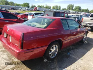 2000 Cadillac Eldorado Touring ETC z VIN 1G6ET129XYU191433, wystawiony jako Copart lot #58108224 z przebiegiem 76 957 mil mil oraz Szkody całkowita. Historia ofert i sprzedaży dostępna na DreamBid. Obrazek 3.