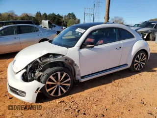 2012 Volkswagen Beetle 2.0T Turbo w/Sun/Snd/Nav PZEV with VIN 3VWVA7AT9CM656846, listed as a Copart auction lot 49466825 with 76,362 mi miles and Salvage Title. Bid and sale history available at carsss.com. Image 1.