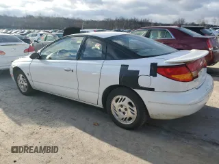 1999 Saturn SC with VIN 1G8ZR1275XZ375833, listed as a Copart auction lot 87960885 with 97,697 mi miles and Salvage Title. Bid and sale history available at carsss.com. Image 2.