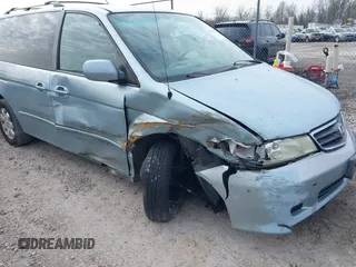 2004 Honda Odyssey EX-RES z VIN 5FNRL18864B093614, wystawiony jako IAAI lot #41674733 z przebiegiem 237 552 mil mil oraz . Historia ofert i sprzedaży dostępna na DreamBid. Obrazek 6.