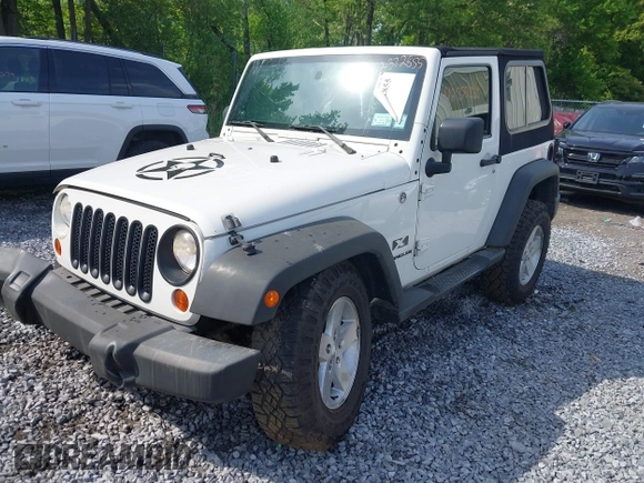 2009 Jeep Wrangler X with VIN 1J4FA24119L727658, listed as a IAAI auction lot 42372855 with 145,450 mi miles and . Bid and sale history available at DreamBid. Image 2.